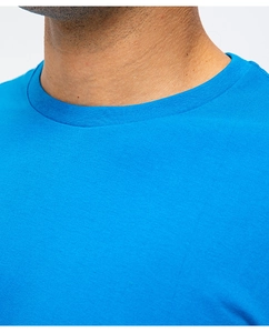 Detail shot of bright blue crew neck cotton T-shirt featuring ribbed neckline stitching