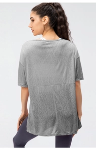 Rear view of loose fit breathable short sleeve yoga top with horizontal seam detail