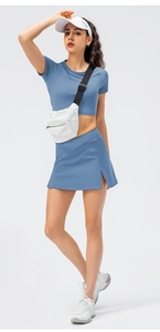 Detailed view of high-waist split tennis skirt and cropped top in blue activewear set