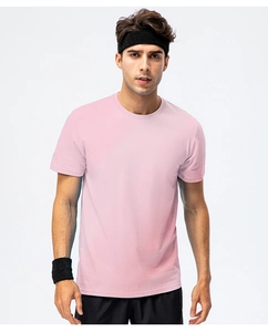 Detail view of pink loose-fit cotton t-shirt with ribbed crew neck and smooth texture