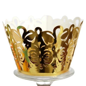 Elegant gold laser-cut hollow cupcake wrappers with intricate vine pattern for weddings