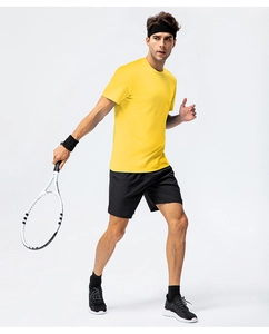 Close-up of bright yellow cotton t-shirt with crew neck and breathable athletic fabric