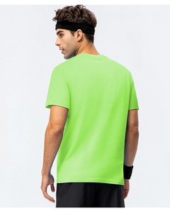 Back view of a neon green cotton crew neck t-shirt for men in a gym sports setting