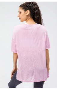 Rear view of loose-fit light pink breathable sports t-shirt with back cut-out detail
