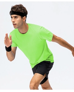 Action shot of men's fluorescent green cotton T-shirt with breathable running fabric