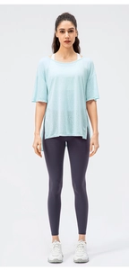 Women's light blue yoga cover-up with side slit and high-waisted purple gym leggings
