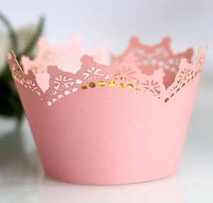 Pink laser-cut crown cupcake wrapper for weddings featuring elegant hollow lace design