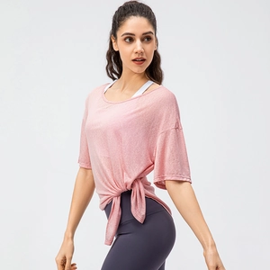 Women's pink quick-dry yoga top with side knot detail and breathable fabric for running