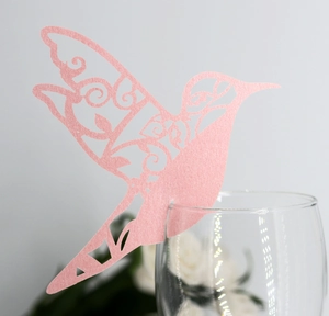 Elegant laser-cut pink hummingbird place card for wedding wine glass decoration
