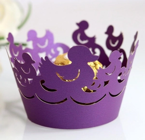Detailed macro view of purple laser-cut duck hollow cupcake wrapper for birthday parties