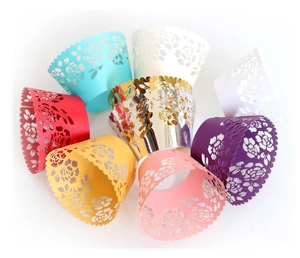 Laser cut lace cupcake wrappers in multiple vibrant colors with floral hollow design