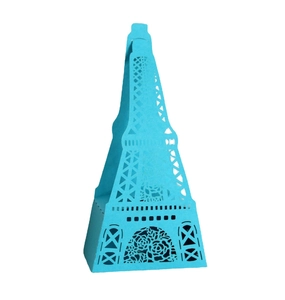 Detail of laser-cut Eiffel Tower sky blue paper candy box with intricate floral hollow patterns
