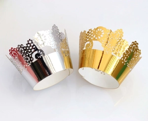 Lace-style laser-cut silver and gold cupcake wrappers for elegant wedding cake decorations