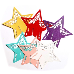Hollow star laser cut paper place cards in vibrant colors for wedding party table decor