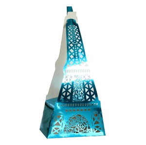 Detailed laser-cut Eiffel Tower gift box in blue pearlescent paper with ribbon