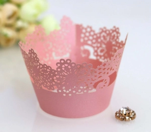 Pink laser-cut lace cupcake wrappers made of pearl paper for wedding cake decoration