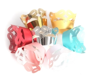 Lace hollow cupcake wrappers with butterfly floral patterns in various shiny metallic colors