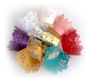 Laser-cut floral lace cupcake wrappers in multiple vibrant colors for dessert decoration