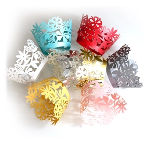 Colorful laser-cut floral cupcake wrappers in pearlescent finishes for party decor