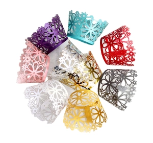 Laser cut floral cupcake wrappers in multiple metallic colors for wedding party decoration
