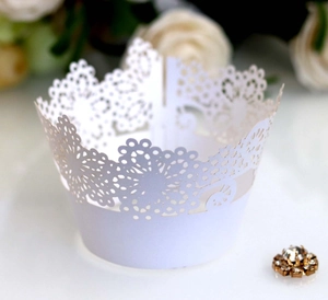 Elegant white laser cut lace cupcake wrappers with delicate floral snowflake pattern