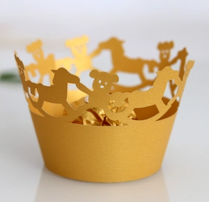 Detailed laser-cut cupcake wrapper featuring golden carousel horses and cute bears