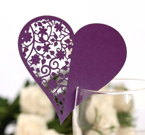 Deep purple heart-shaped laser cut wedding place card for glass decoration on white rose background