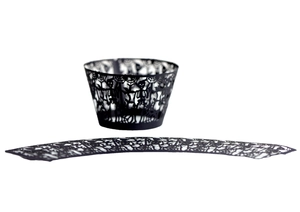 Laser-cut black Halloween cupcake liners featuring spider web and skull decorations