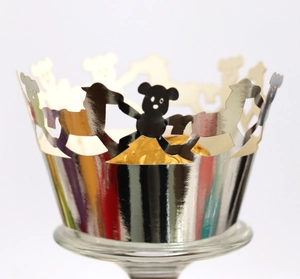 Silver mirror finish cupcake wrapper with laser-cut bear pattern for parties