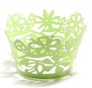 Light green laser-cut cupcake wrappers with floral patterns for wedding party decor