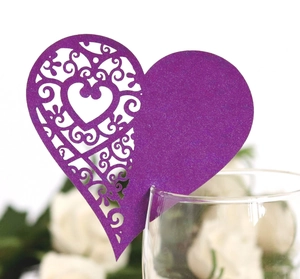 Elegant purple heart-shaped laser-cut wine glass place card with ornate floral patterns