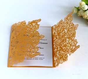 Detailed laser-cut pattern on yellow wedding invitation with elegant printed insert