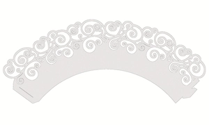 Detailed laser-cut white paper cupcake wrapper with intricate scroll patterns