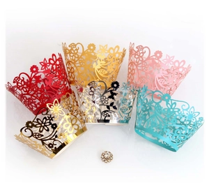 Laser cut floral cupcake wrappers in various colors for elegant wedding party decorations