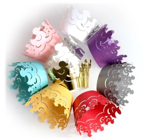 Laser-cut cupcake wrappers with duck patterns in multiple colors for party decoration
