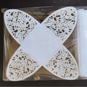 Laser cut white paper gift candy boxes with butterfly patterns in flat packaging