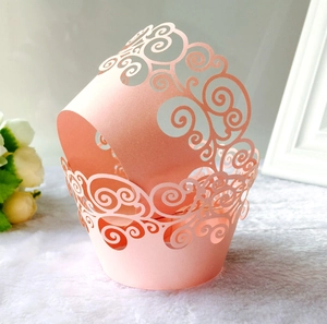 Detailed laser-cut vine hollow cake wrapper in soft pink for wedding party cupcakes