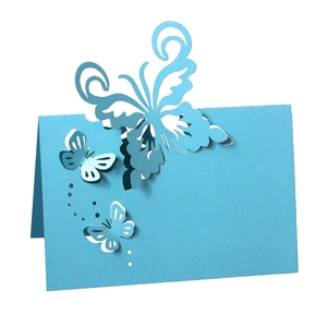 Laser-cut blue butterfly place card with hollow pattern for wedding table decorations