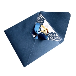 Elegant navy blue laser-cut wedding invitation set with silk ribbon and gold ring icon