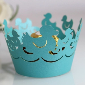 Laser cut paper cupcake wrappers with duck pattern in vibrant turquoise finish