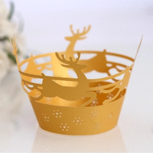 Golden laser-cut elk and snowflake cupcake wrappers with a shiny pearlescent finish