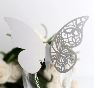 Detailed laser-cut butterfly cup card with elegant floral patterns for wedding decor