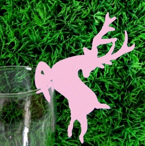 Pink laser-cut reindeer place cards for wine glass rims at wedding or Christmas parties
