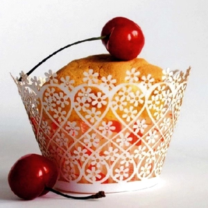 Laser cut floral cupcake wrappers in white lace design for wedding party decoration