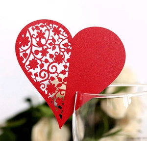 Laser-cut heart-shaped place card in red for wedding wine glass decoration