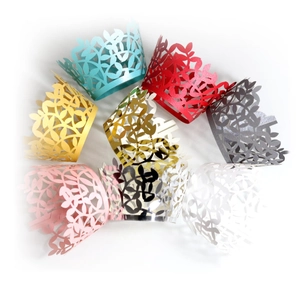 Laser-cut cupcake wrappers with golden leaf patterns for wedding party decorations