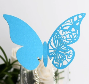Sky blue laser-cut butterfly place card for wine glass with intricate hollow patterns