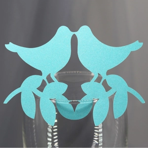 Laser cut sky blue bird wine glass place cards with shimmering pearlescent finish