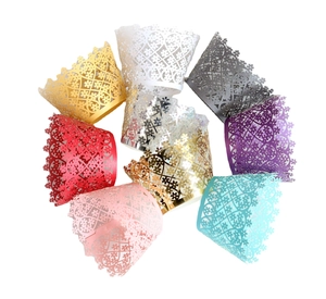 Laser cut floral cupcake wrappers in multiple metallic colors for wedding and party cakes