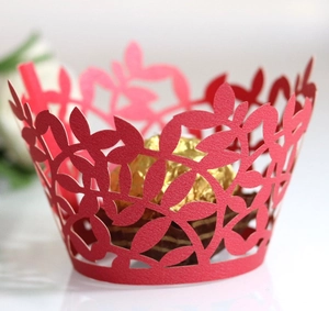 Red laser-cut cupcake wrapper featuring intricate leaf patterns for party cake decoration